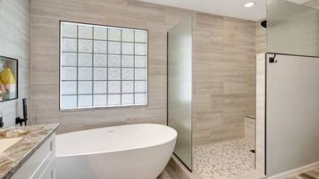 Bathtub, hair dryer, towels
