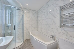 Bathtub, hair dryer, towels, soap