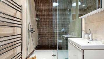 Bathtub, hair dryer, towels, soap