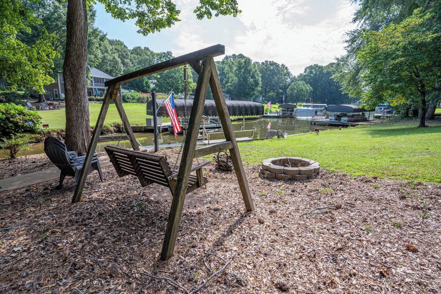 Lakefront flat backyard with firepit