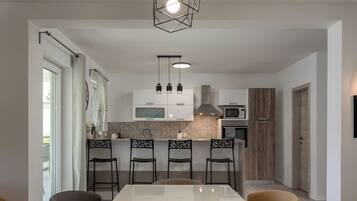 Villa | Private kitchen | Fridge, microwave, oven, stovetop