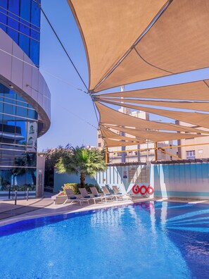Outdoor pool, open 6:00 AM to 10:00 PM, pool umbrellas, pool loungers