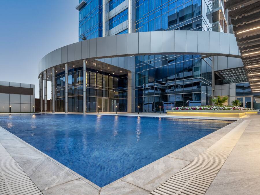 Outdoor pool, open 6:00 AM to 10:00 PM, pool umbrellas, sun loungers
