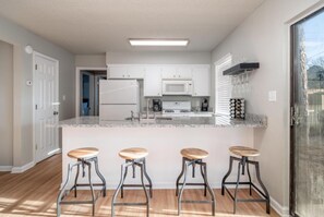 Townhome, 4 Bedrooms, Resort View | Private kitchen | Full-size fridge, microwave, stovetop, dishwasher