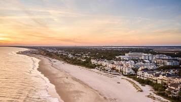 On the beach, sun-loungers, beach umbrellas, beach bar