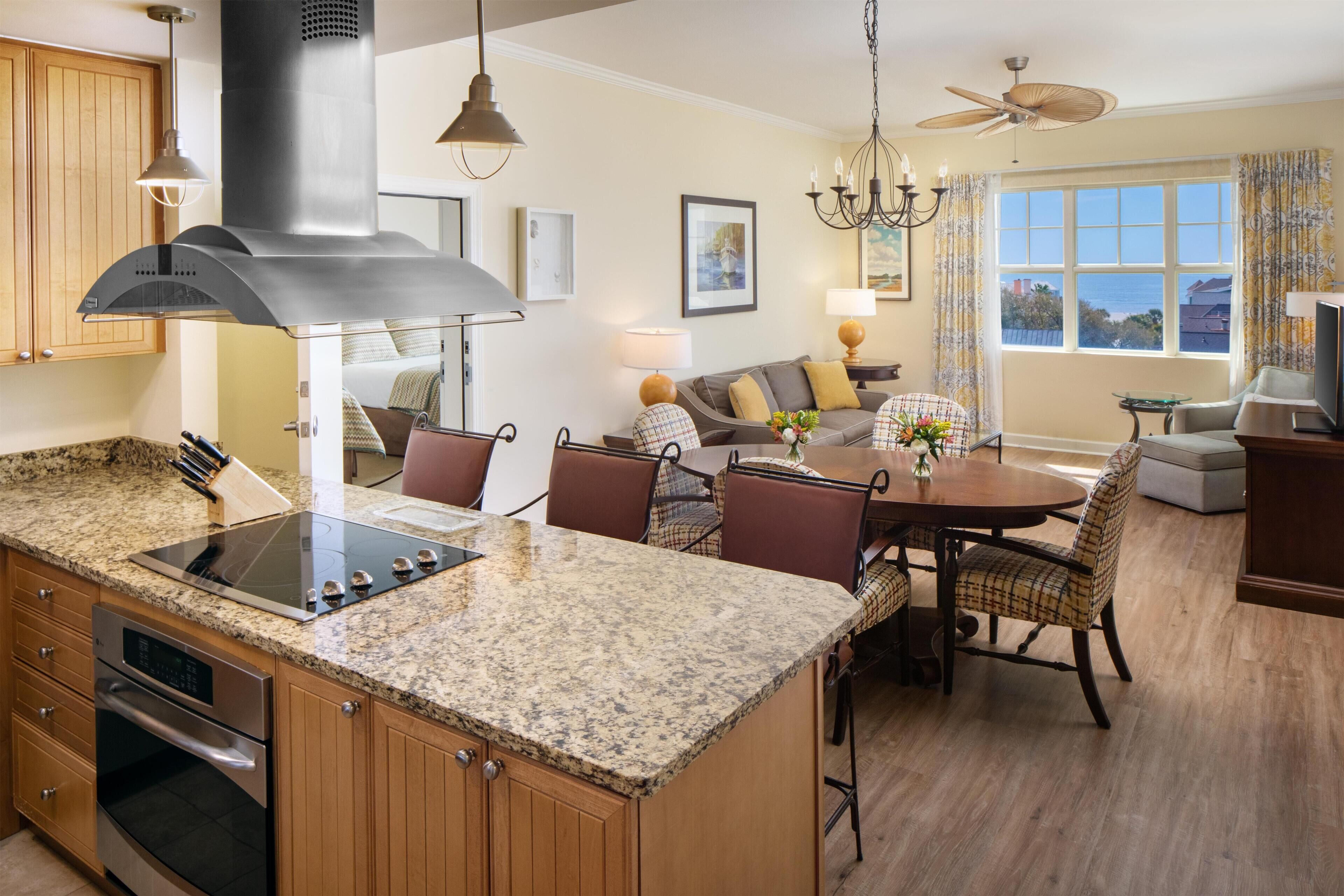 A kitchen with granite countertops, wooden cabinets, and a built-in oven.