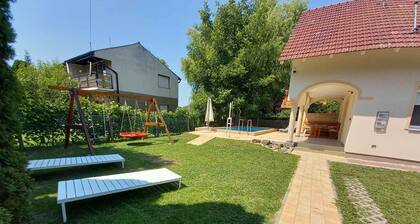 Holiday home with pool and garden shower