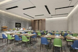 A conference room with tables and chairs, a buffet area, and a wall-mounted sign. - Hampton Apartments by Hilton Shenzhen Futian Mangrove Park (Shenzhen)