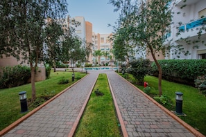 Stroll along the beautifully manicured pathway to this modern building.