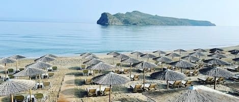 On the beach, sun loungers, beach towels