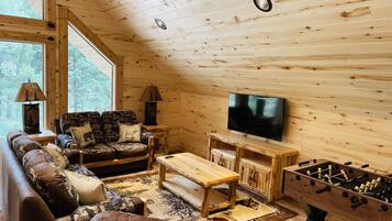 Smart TV, fireplace, foosball