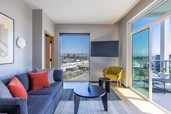 Premium Suite, 1 King Bed, Balcony | Premium bedding, down comforters, minibar, in-room safe at The Shay Hotel