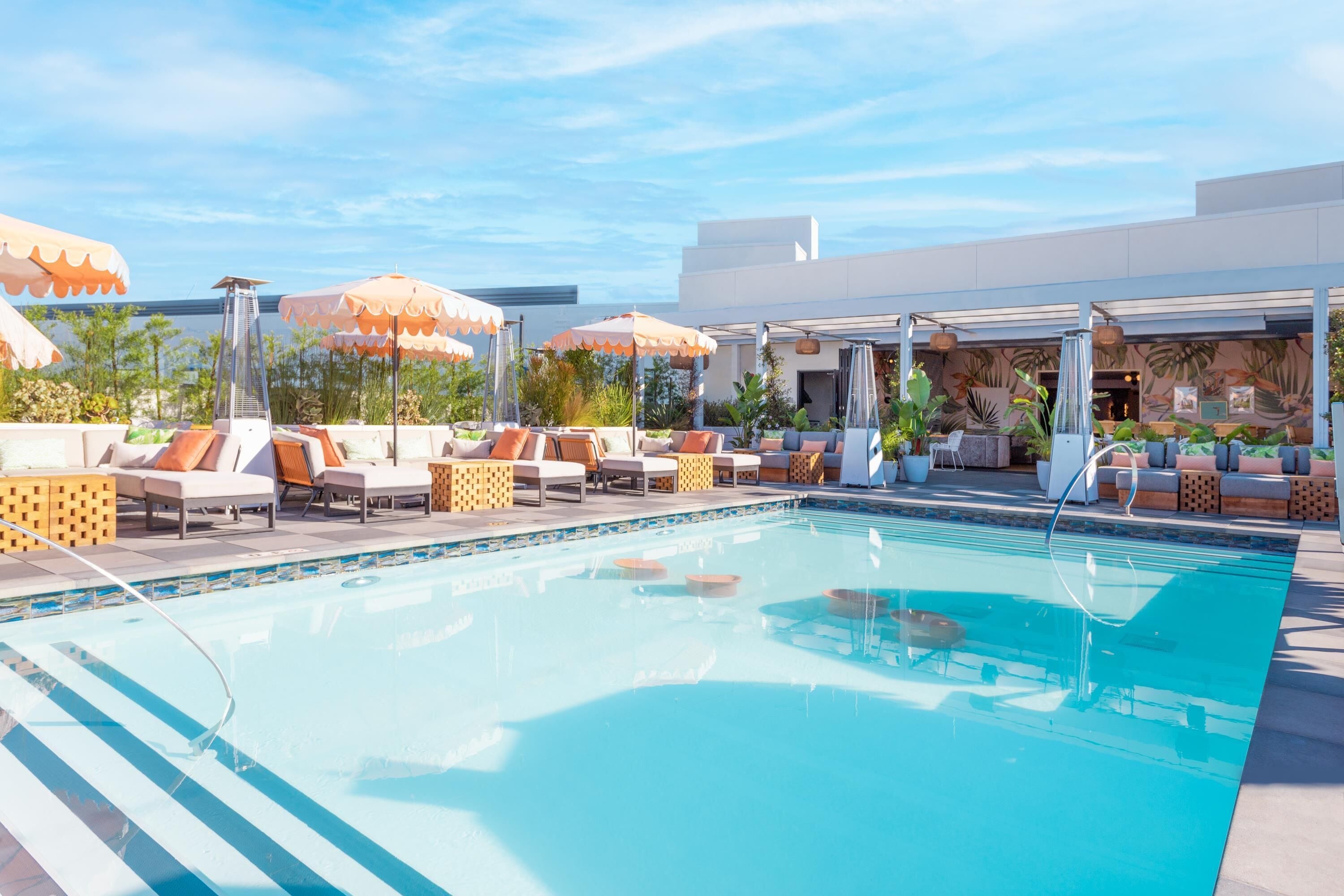 outdoor pool, open 8:00 am to 8:00 pm, pool loungers