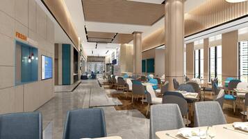 A modern restaurant interior with multiple dining tables and chairs, a visible menu board, and a counter area.