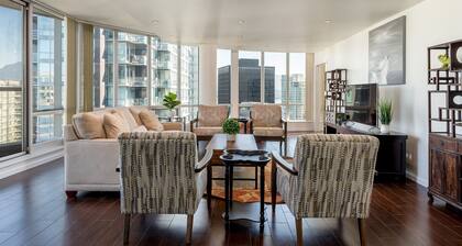 Elevated Coal Harbour living with panoramic harbour & mountain views, steps to Vancouver's iconic waterfront, dining and shopping.