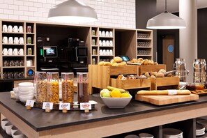 A breakfast buffet with various food items and beverages. - Holiday Inn Express Offenburg (Offenburg)