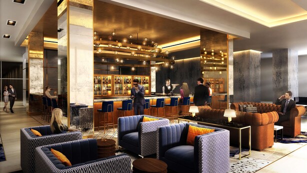 A modern bar area with seating and a bar counter.