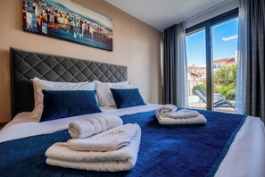 Exclusive Apartment, 1 Bedroom, Pool Access, Sea View | 1 bedroom, in-room safe, individually decorated, individually furnished