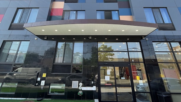A modern building with a multi-colored facade and large windows. - Super 8 by Wyndham Brooklyn Williamsburg (Brooklyn)
