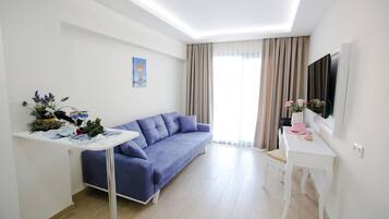 49-tums smart-tv med kabelkanaler och tv