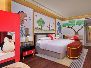 A bedroom with a bed, nightstand, and plush toys. - Hualuxe Suzhou Bay Hot Spring Resort, an IHG Hotel (Suzhou)