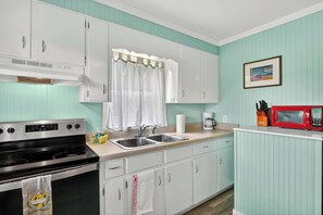 Fridge, microwave, oven, stovetop - Relaxing Ground-Floor Escape in Holly Ridge (Topsail Beach)