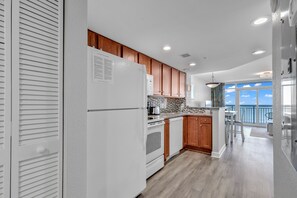 Comfort Condo, 1 Bedroom, Balcony, Beach View | Private kitchen | Full-size fridge, microwave, oven, stovetop