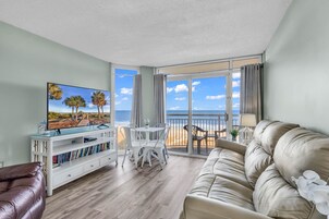 Signature Condo, 1 Bedroom, Ocean View, Oceanfront | Living room | 50-inch Smart TV with digital channels