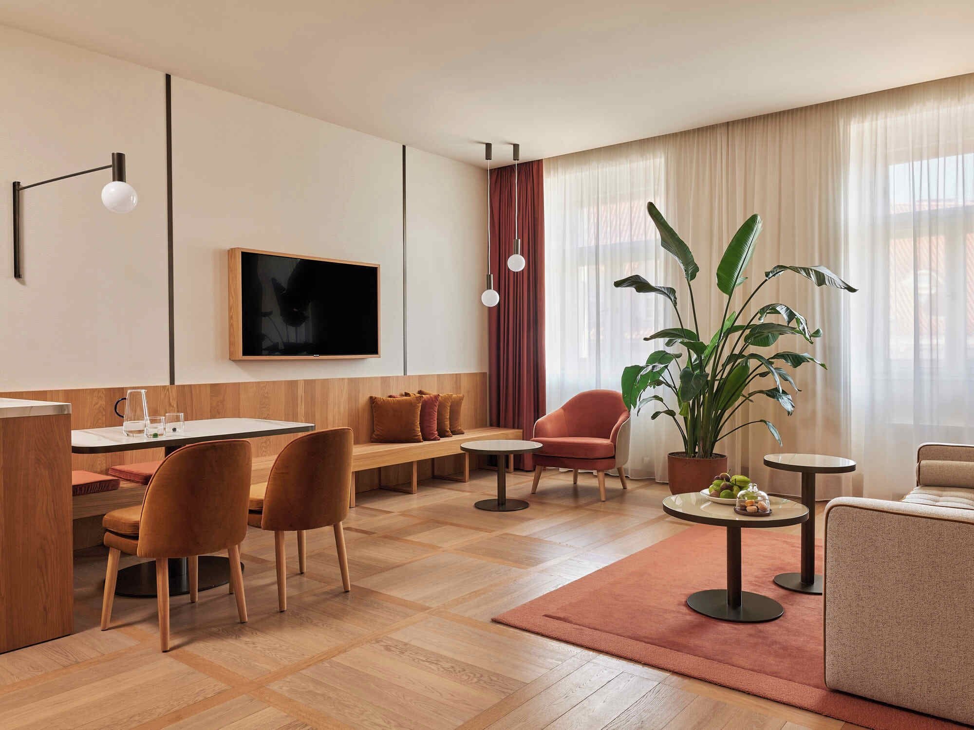 Deluxe Suite | Living room | 44-inch LED TV with satellite channels, TV