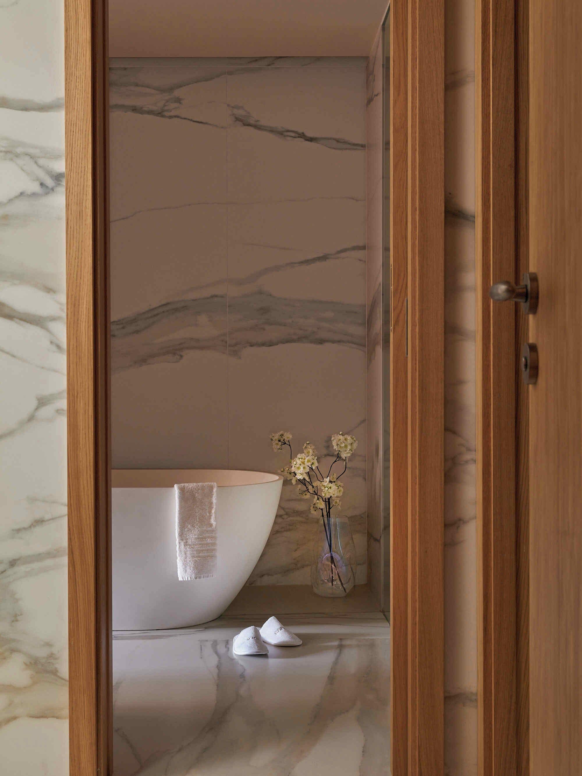 deluxe suite | bathroom | designer toiletries, hair dryer, bathrobes, slippers