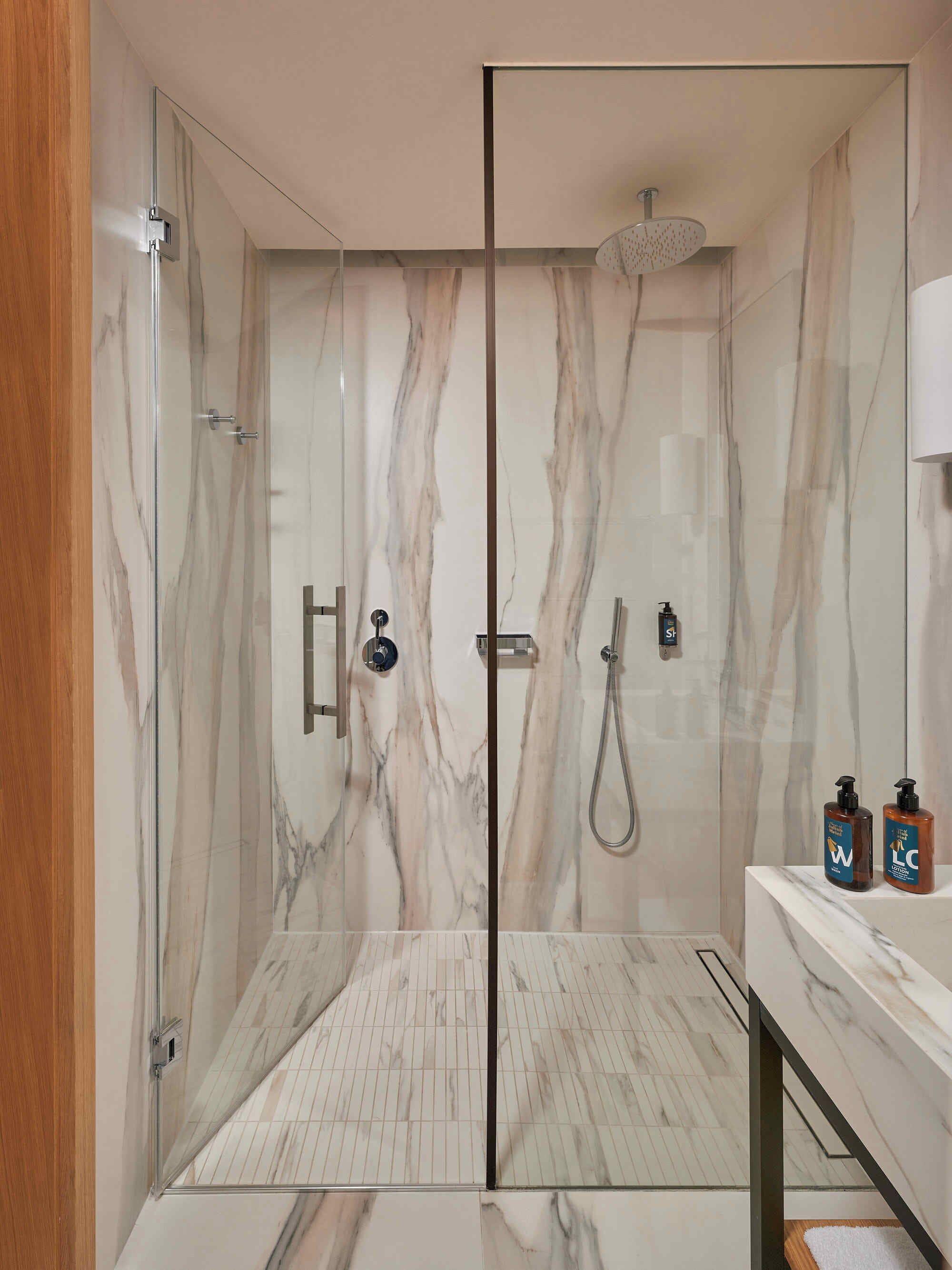 deluxe studio | bathroom | designer toiletries, hair dryer, bathrobes, slippers