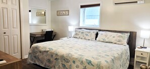 A bedroom with a bed, desk, chair, and a window. - Large three bedroom condo, steps from beach and amusement area (Old Orchard Beach)