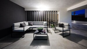 A modern living room with a sectional sofa, a coffee table, and a chair. - Nice Apartment in Zadar With 1 Bedrooms, Wifi and Outdoor Swimming Pool (Zadar)
