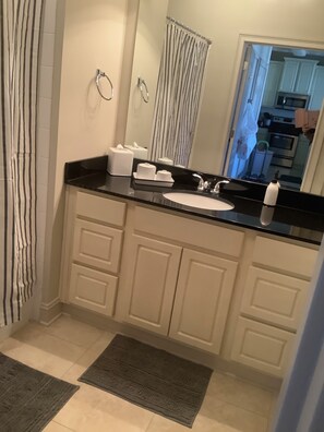 Combined shower/bathtub, hair dryer, towels, soap