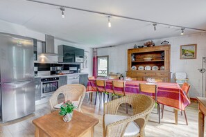 Enjoy meals in the kitchen with modern appliances and adjacent dining area.