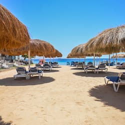 On the beach, sun loungers, beach umbrellas, beach towels