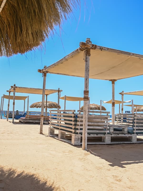 On the beach, sun loungers, beach umbrellas, beach towels