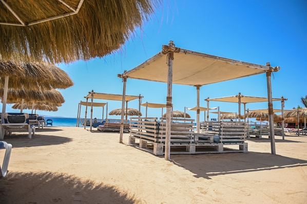 On the beach, sun loungers, beach umbrellas, beach towels