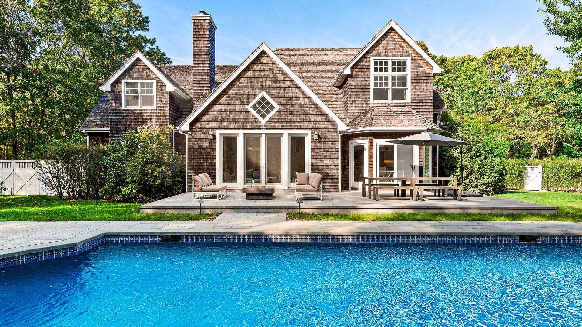 Unwind at this timeless estate featuring a chefs kitchen, classic...