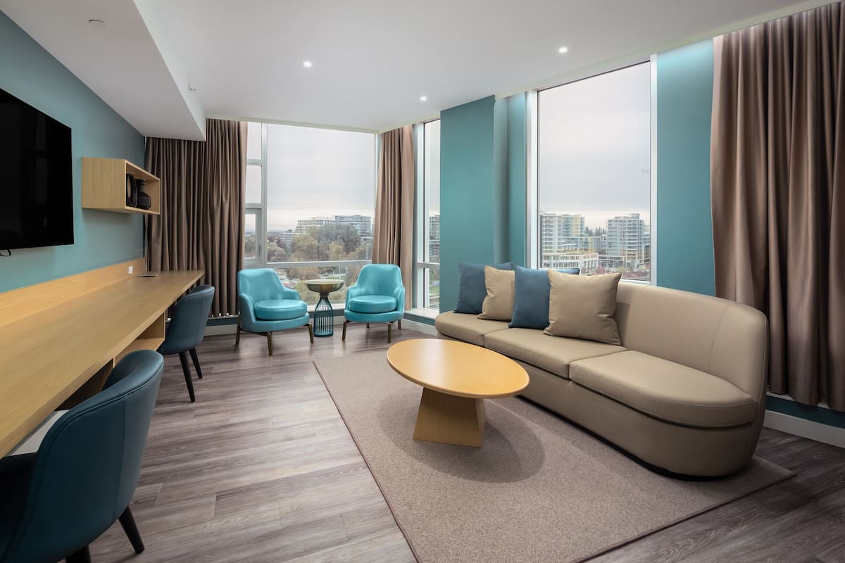 Signature Suite | Living area | 55-inch Smart TV with digital channels, TV, Netflix
