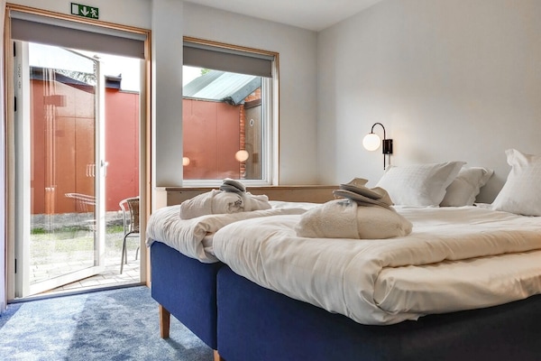 Ropa de cama de alta calidad, minibar, escritorio y cortinas blackout