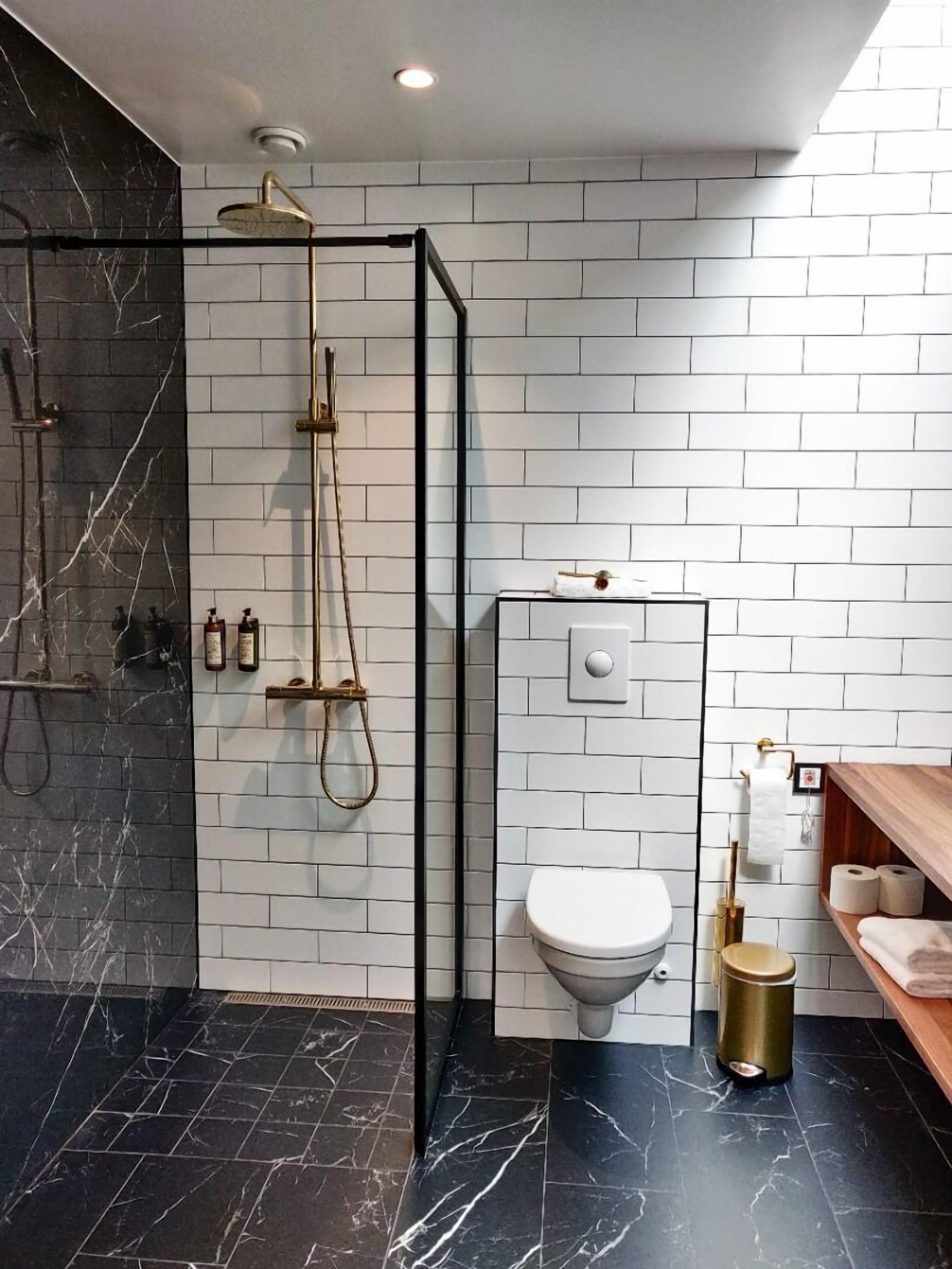 premium double room | bathroom | shower, rainfall showerhead, hair dryer, heated floors