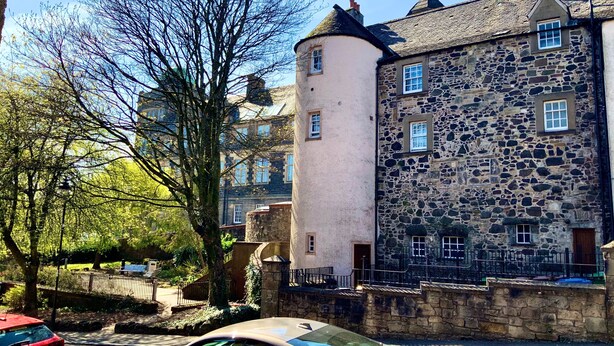 A stone building with multiple windows and a turret. - Old Spittal Hospital Apartment (Stirling)