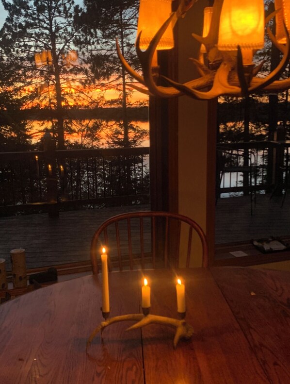 Relax in a serene outdoor space with a table, chair, and breathtaking views.