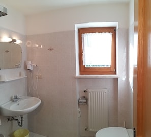 Bathtub, hair dryer, towels