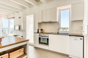 Fridge, microwave, oven, stovetop - "Apartamento en Es Grau con vistas" with Sea View, A/C, Wi-Fi, Terrace & Balcony (Mahón)