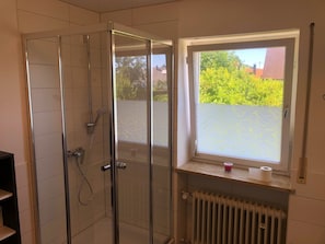 Shower, hair dryer, towels, soap