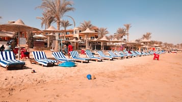 Private beach, beach umbrellas, beach towels, beach bar