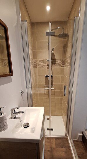 Shower, hair dryer, towels, soap