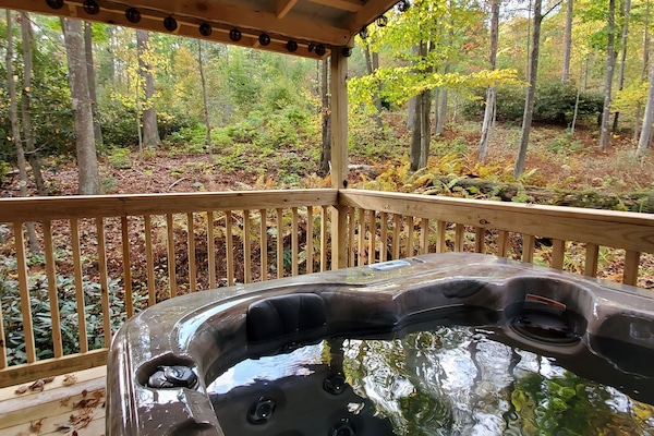 Enjoy the hot tub in the serenity of the mountains.
